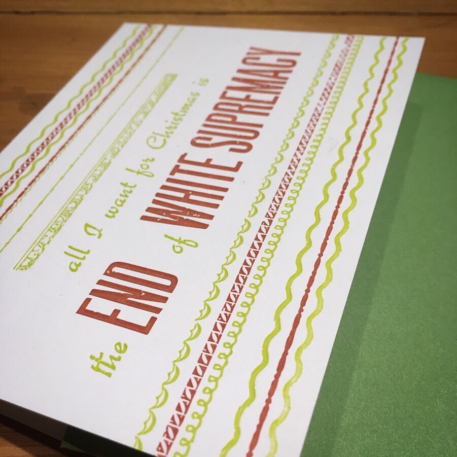 Letterpress-printed Christmas card with festive red and green borders. Text reads: All I Want for Christmas is the End of White Supremacy. 