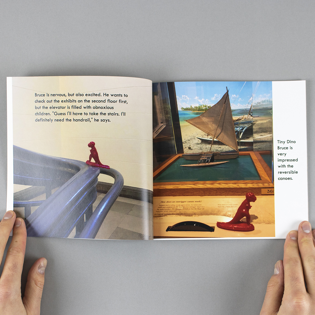 Inside spread; toy dinosaur climbs the banister of a staircase and views an interactive diorama.