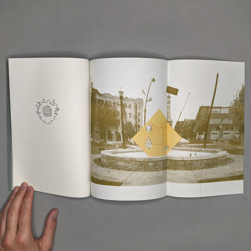 Terra Nullius three-page spread, with a fireball on the left and a distorted traffic circle on the right.