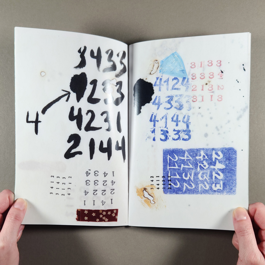 "640 numbers" inside spread: grids of numbers brushed and stamped onto pages with burned holes and collage elements.