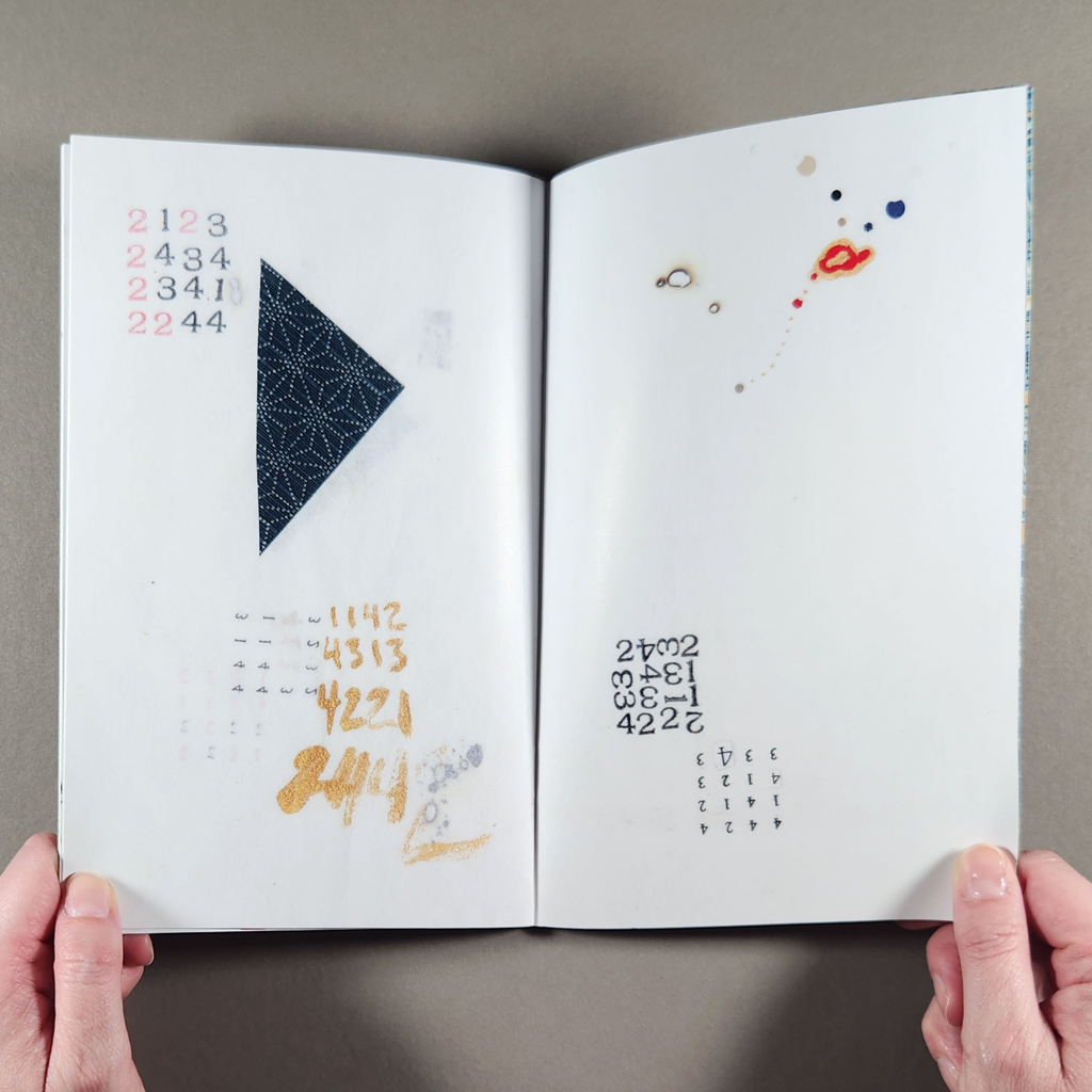 "640 numbers" inside spread: grids of numbers written and stamped onto pages with burned holes, ink drawing, and collage.